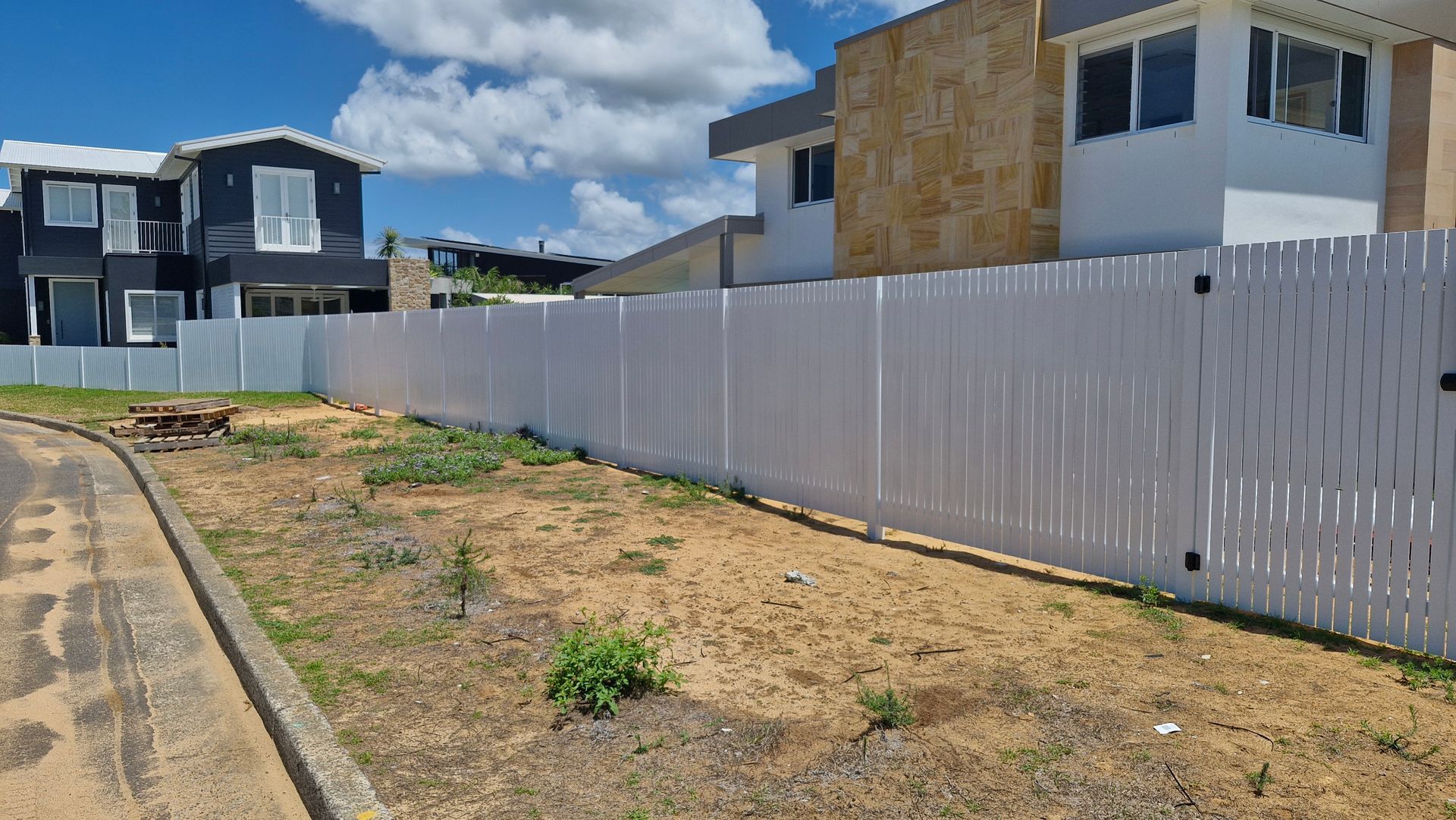 White Picket Fence With Gate in Front of a House — Strike Fencing & Gates In Tuggerah, NSW