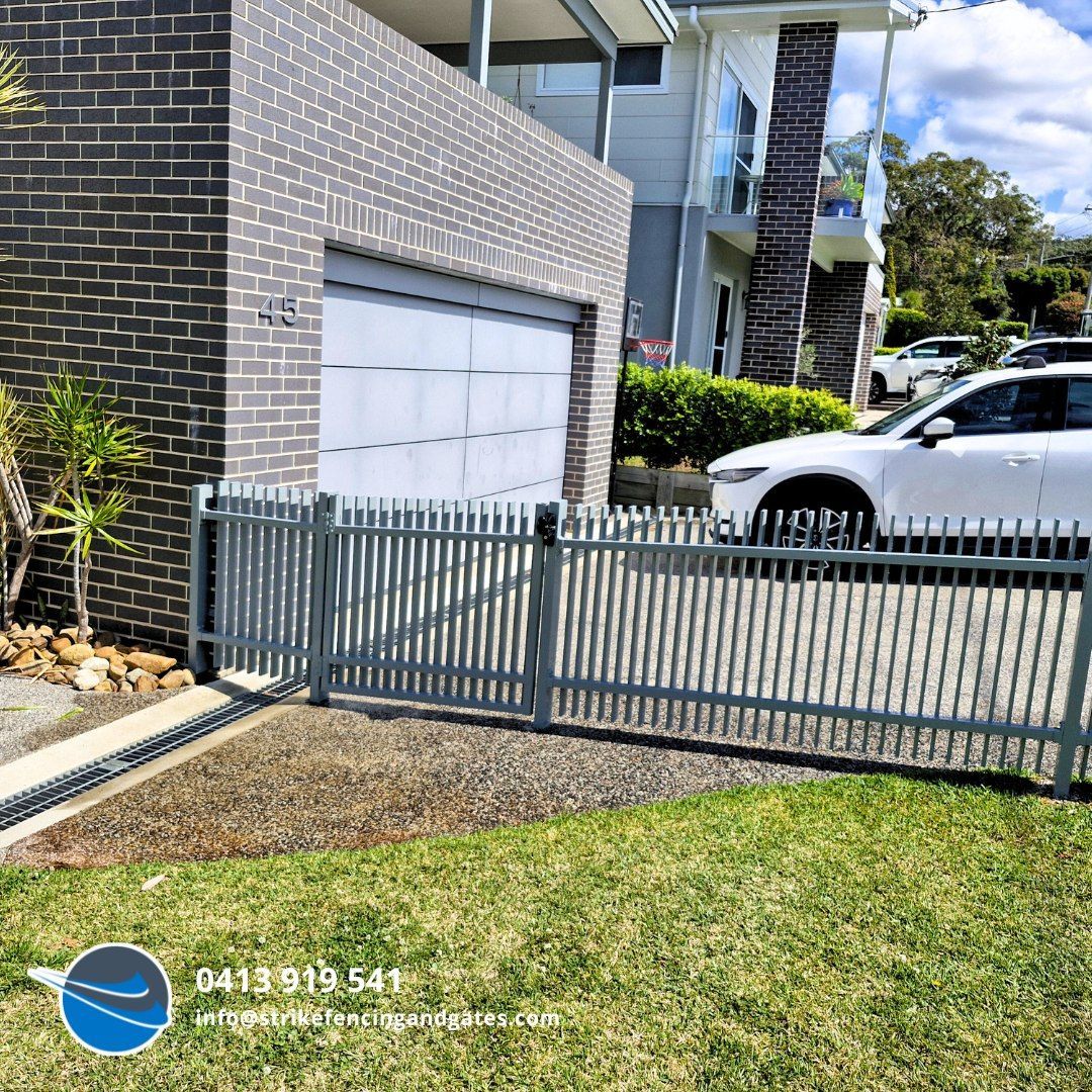 Grey Metal Fence and Gate in Front of a House — Strike Fencing & Gates In Gosford, NSW