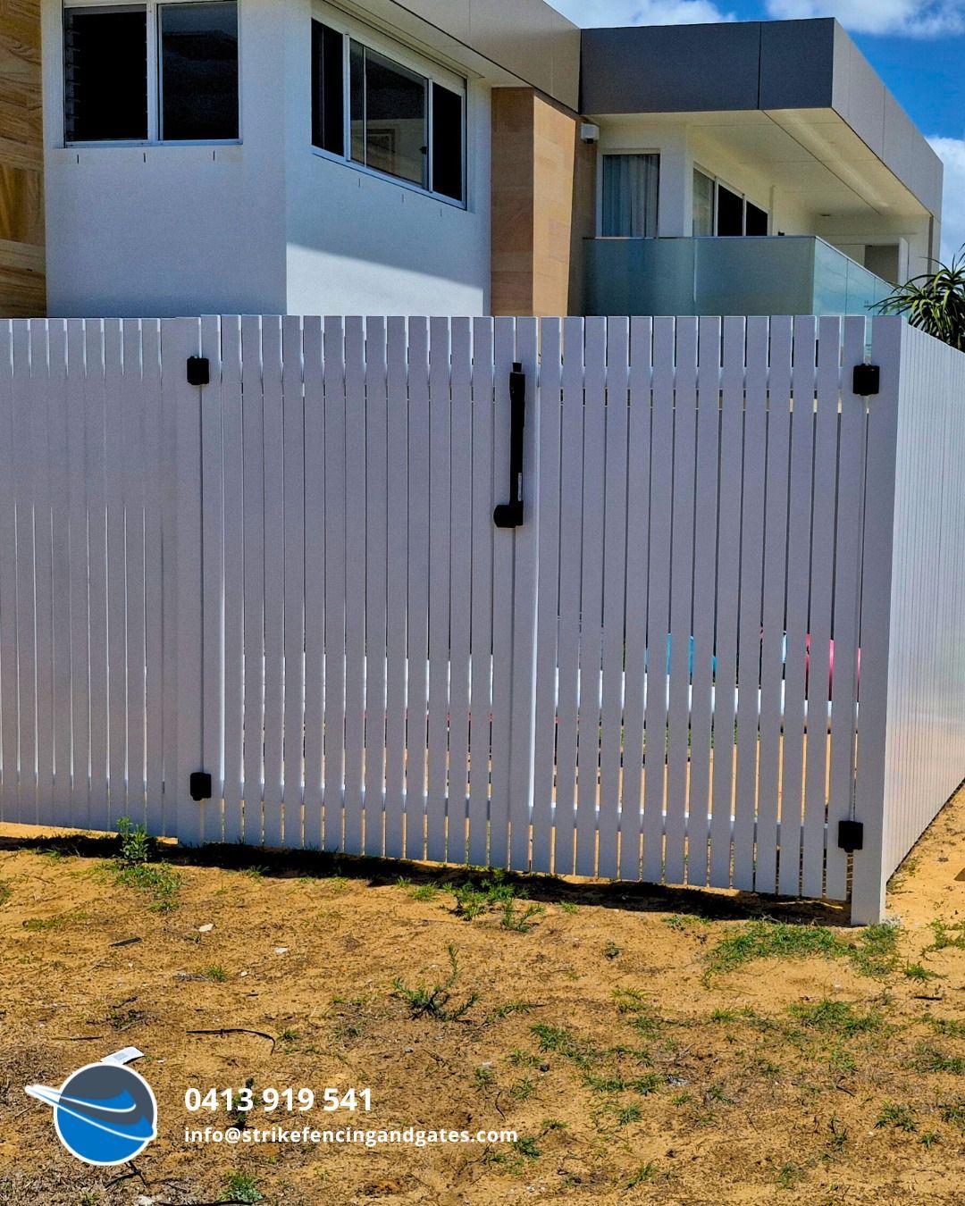 White Picket Fence With Black Hinges and Handle, in Front of a Modern House — Strike Fencing & Gates In Gosford, NSW