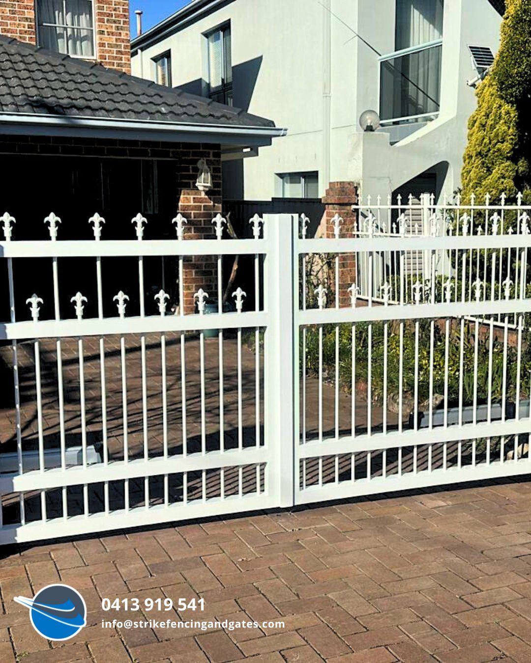 White Metal Driveway Gate, Leading to a Home With a Brick Driveway — Strike Fencing & Gates In Erina, NSW