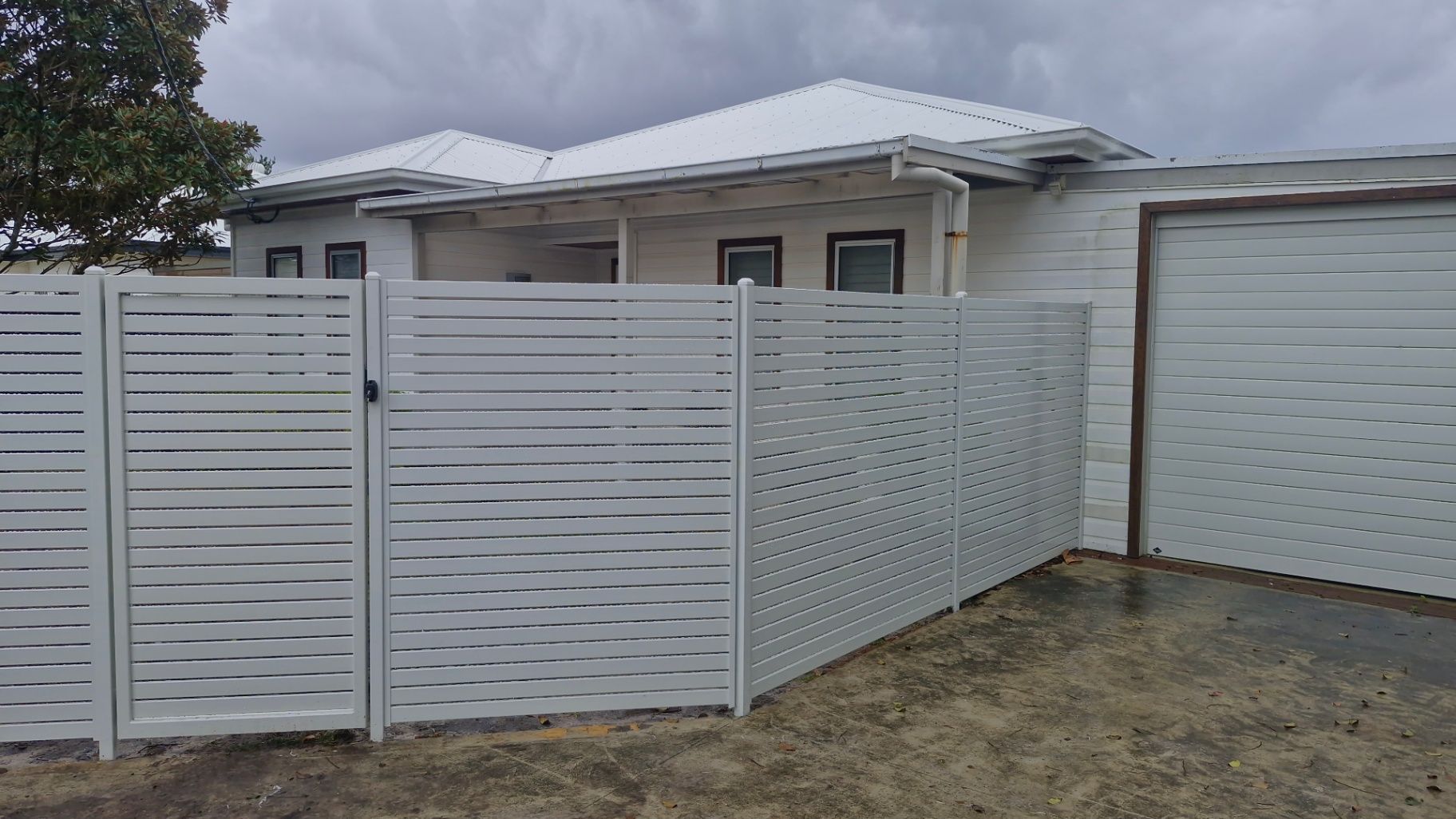 Light Grey House With Matching Fence — Strike Fencing & Gates In Killarney, NSW