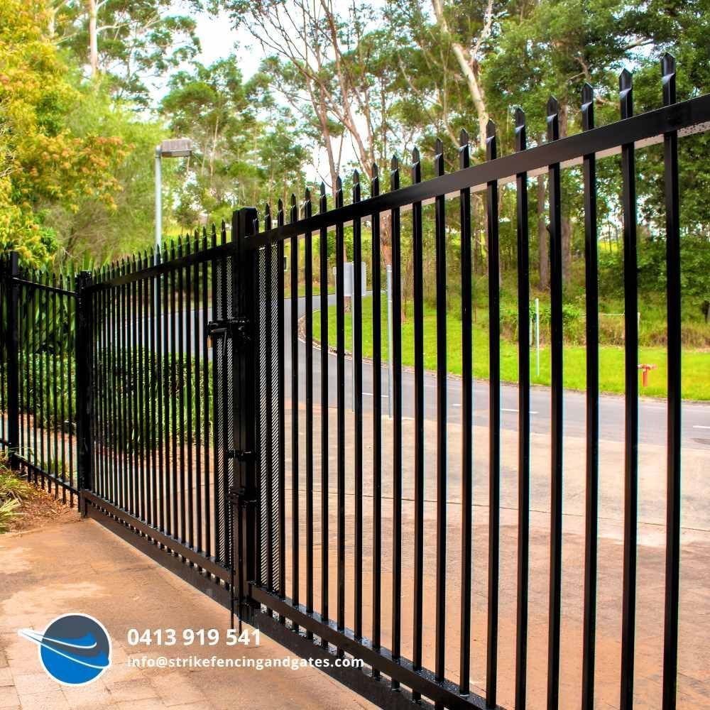 Black Metal Fence With Vertical Bars — Strike Fencing & Gates In Wamberal, NSW