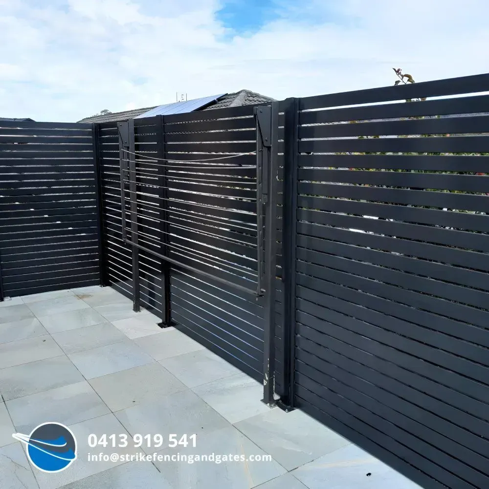 Black Horizontal Slat Fence With Gate — Strike Fencing & Gates In Wamberal, NSW