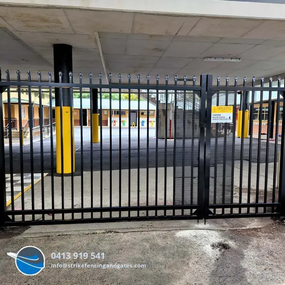 Black Metal Security Gate — Strike Fencing & Gates In Bateau Bay, NSW