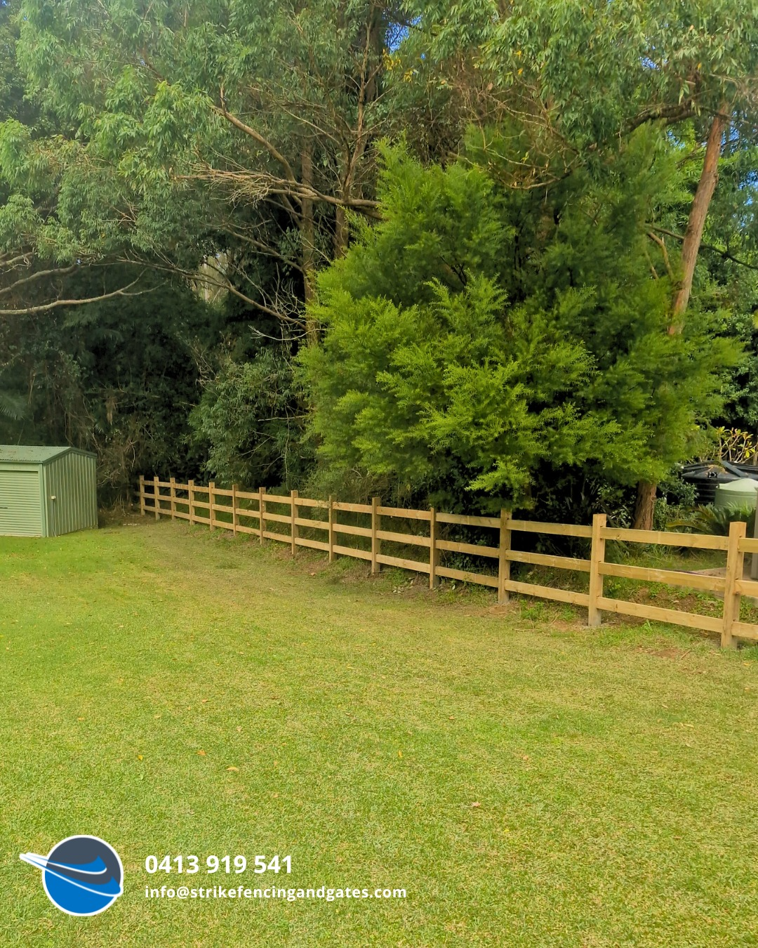 A Split-rail Fence in a Grassy Yard — Strike Fencing & Gates In Erina, NSW