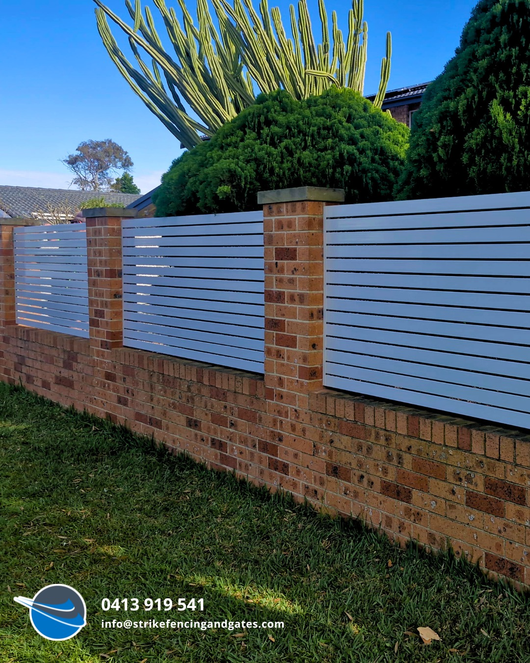 Brick Wall Topped With Horizontal Grey Slatted Fence Panels — Strike Fencing & Gates In Erina, NSW