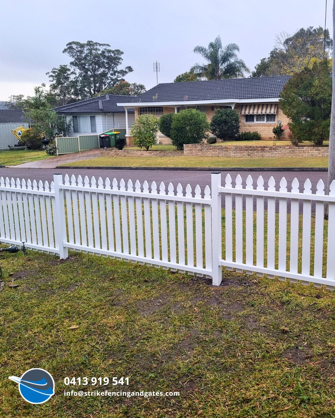 White Picket Fence in Front of a House — Strike Fencing & Gates In Tuggerah, NSW