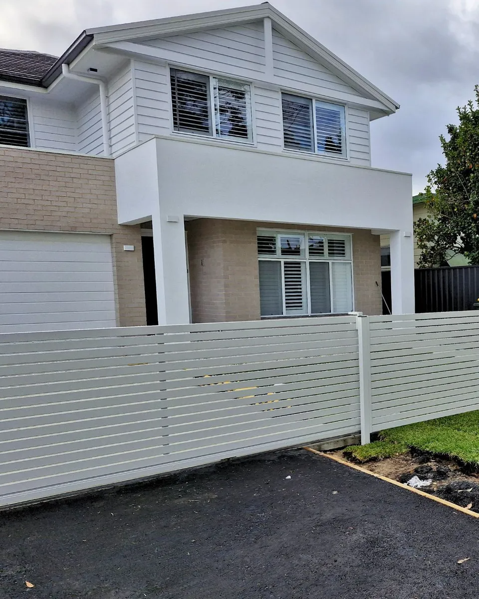 Two-storey White House With a White Fence — Strike Fencing & Gates In Tuggerah, NSW