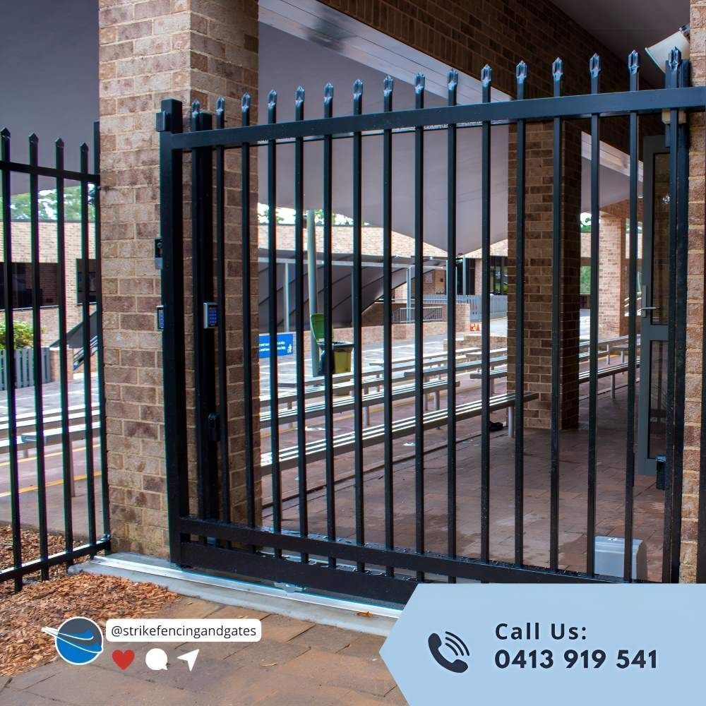 Black Metal Gate Partially Open With Brick Columns — Strike Fencing & Gates In Terrigal, NSW