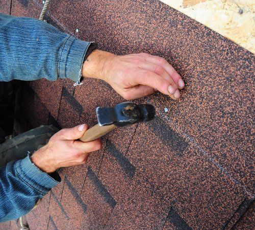 Installing roof shingles - K & M Roofing in Casa Grande,, AZ