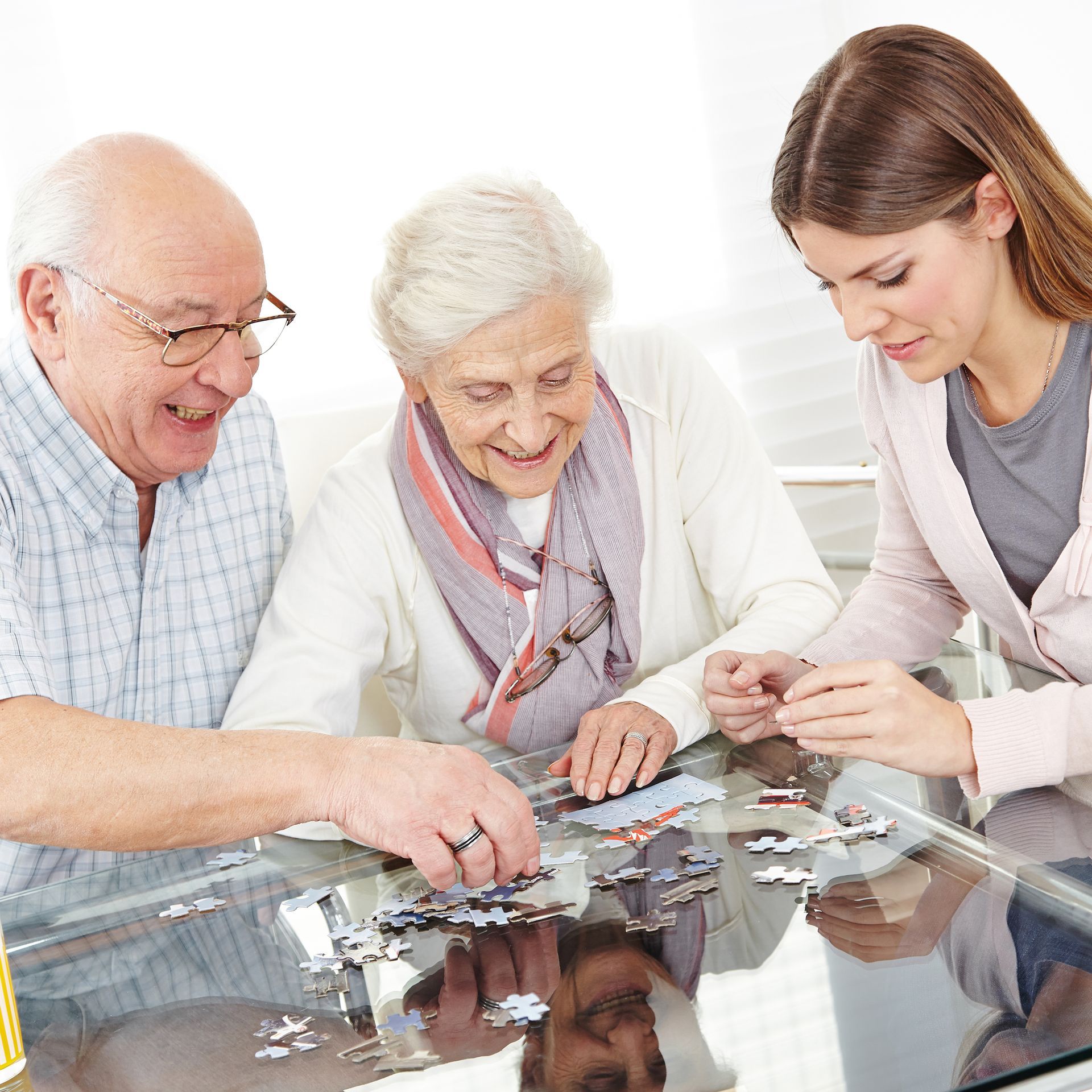 Engaged caregiver with senior clients – personalized in-home care in Arizona