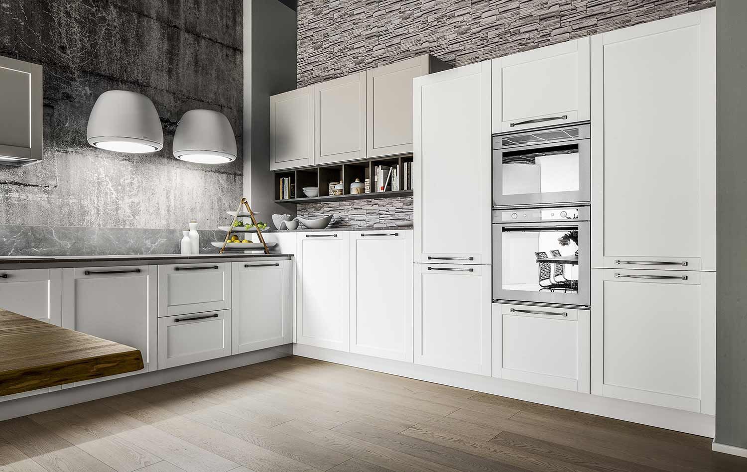 una cucina con mobili bianchi ed elettrodomestici in acciaio inossidabile