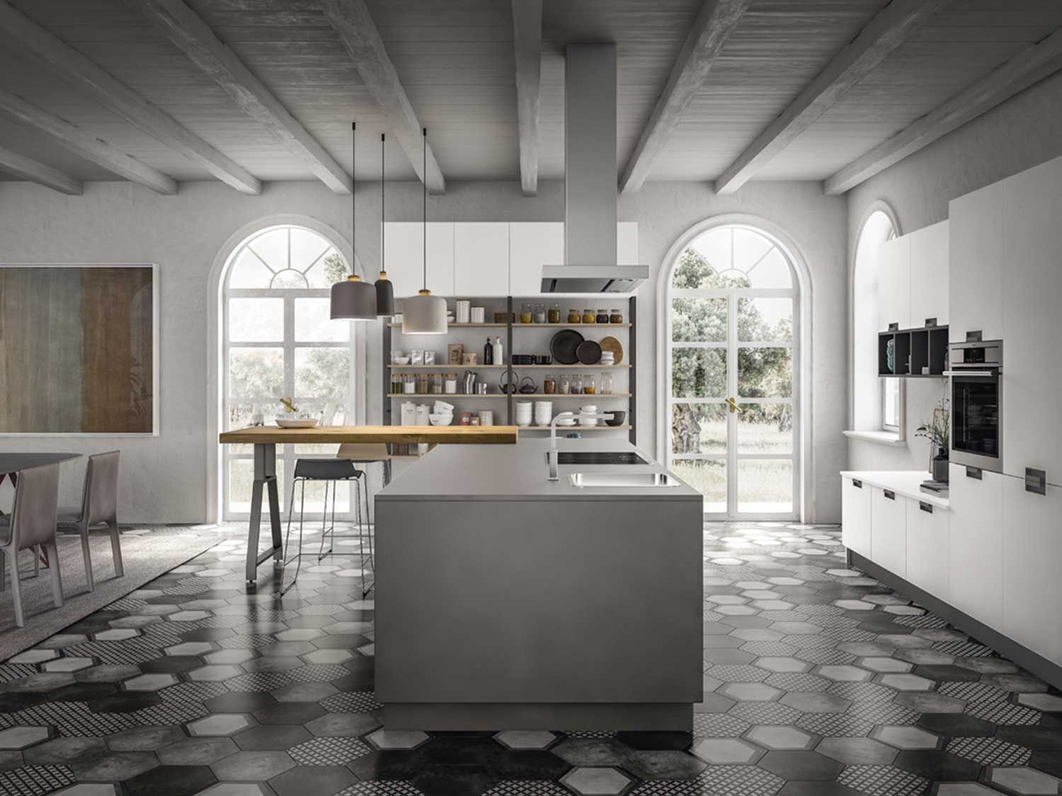 cucina con mobili bianchi e una grande isola al centro.