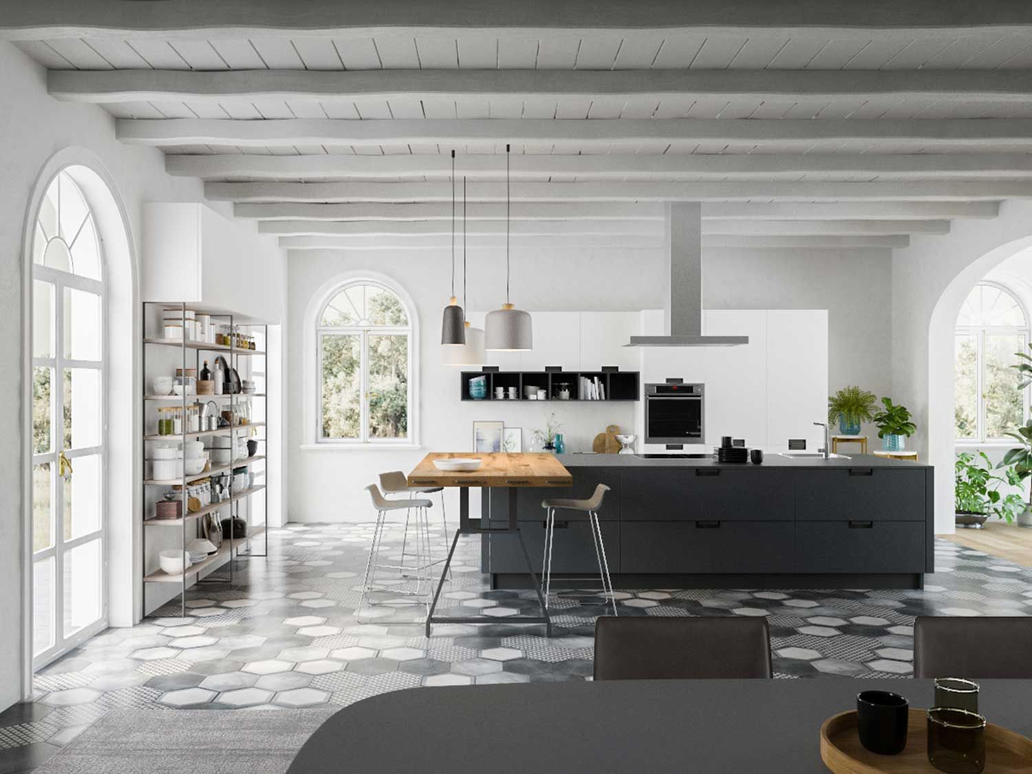 cucina con tavolo e sedie e una grande isola al centro della stanza.