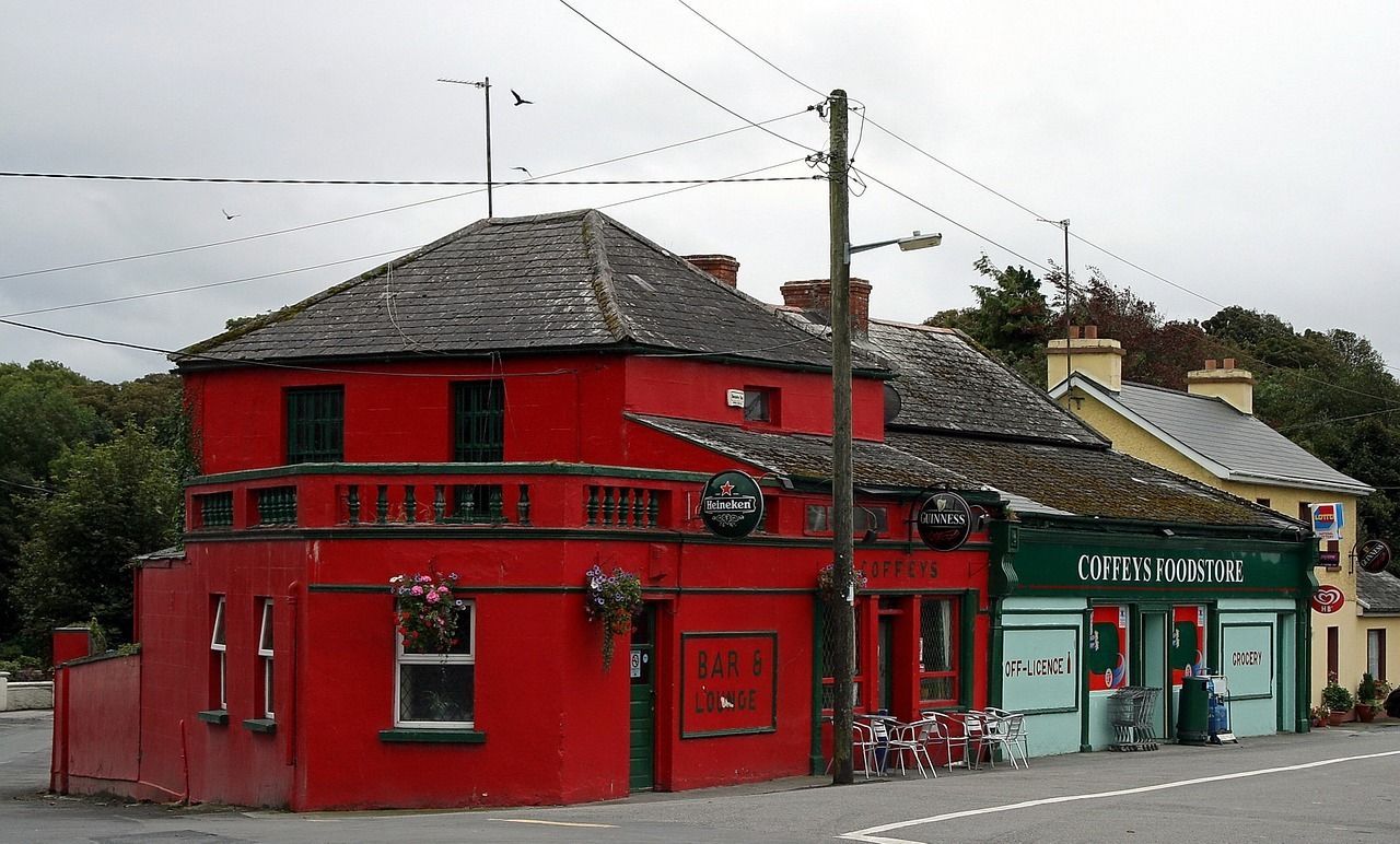 A red building with a green sign that says ' o'reilly furniture ' on it
