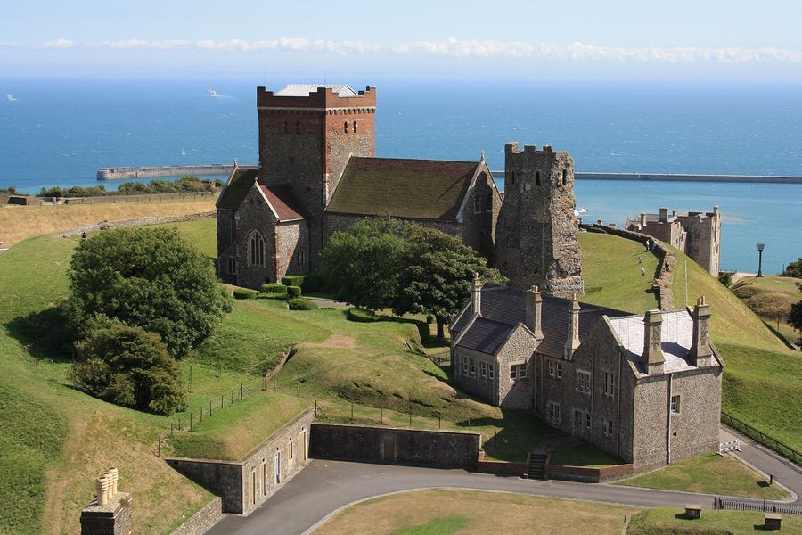 A castle sitting on top of a hill overlooking the ocean