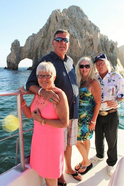A group of people posing for a picture on a boat