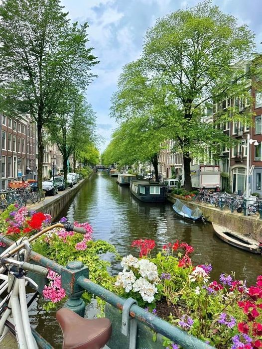A statue of a snowman wearing a cowboy hat and holding a banjo.
