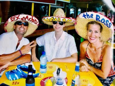 A man and two women wearing sombrero hats that say the boss