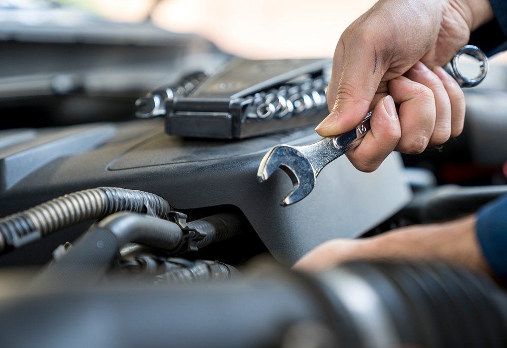 Auto Mechanic Fixing Car Engine | Sparks, NV | Bimmer Experts Reno