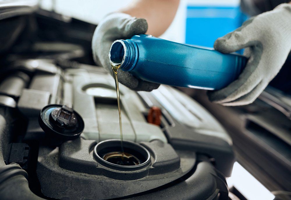 Auto Technicians Changing Engine Oil | Sparks, NV | Bimmer Experts Reno