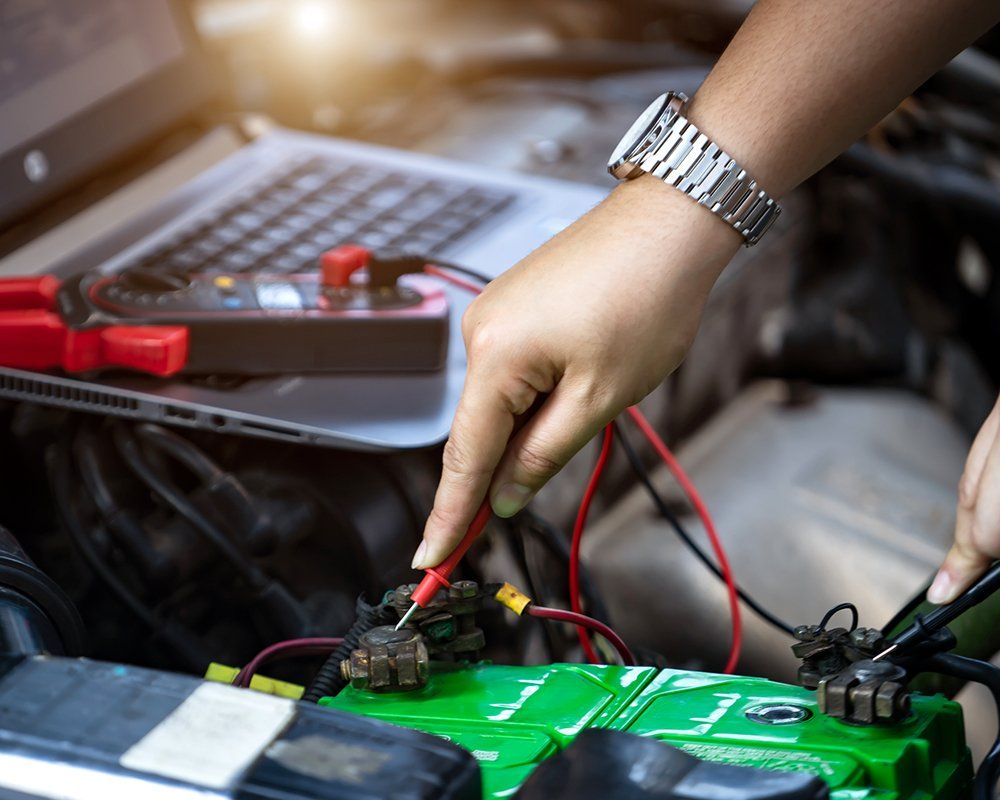 Auto Mechanic Checking the Voltage | Sparks, NV | Bimmer Experts Reno