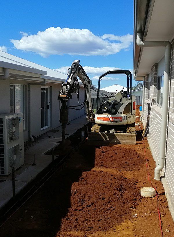 Tractor Digger — Landscape Construction In Newrybar, NSW