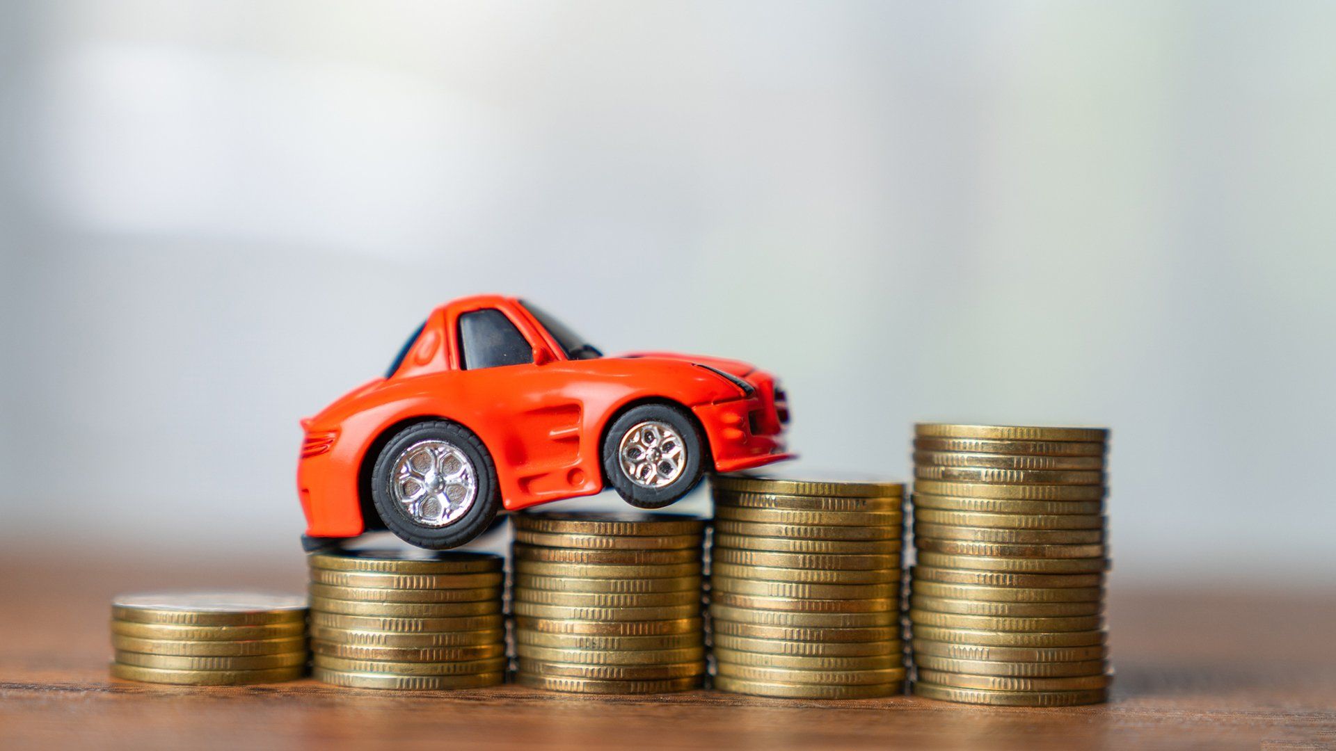 Car Toy On Coins — Holliston, MA — Seah Insurance Agency