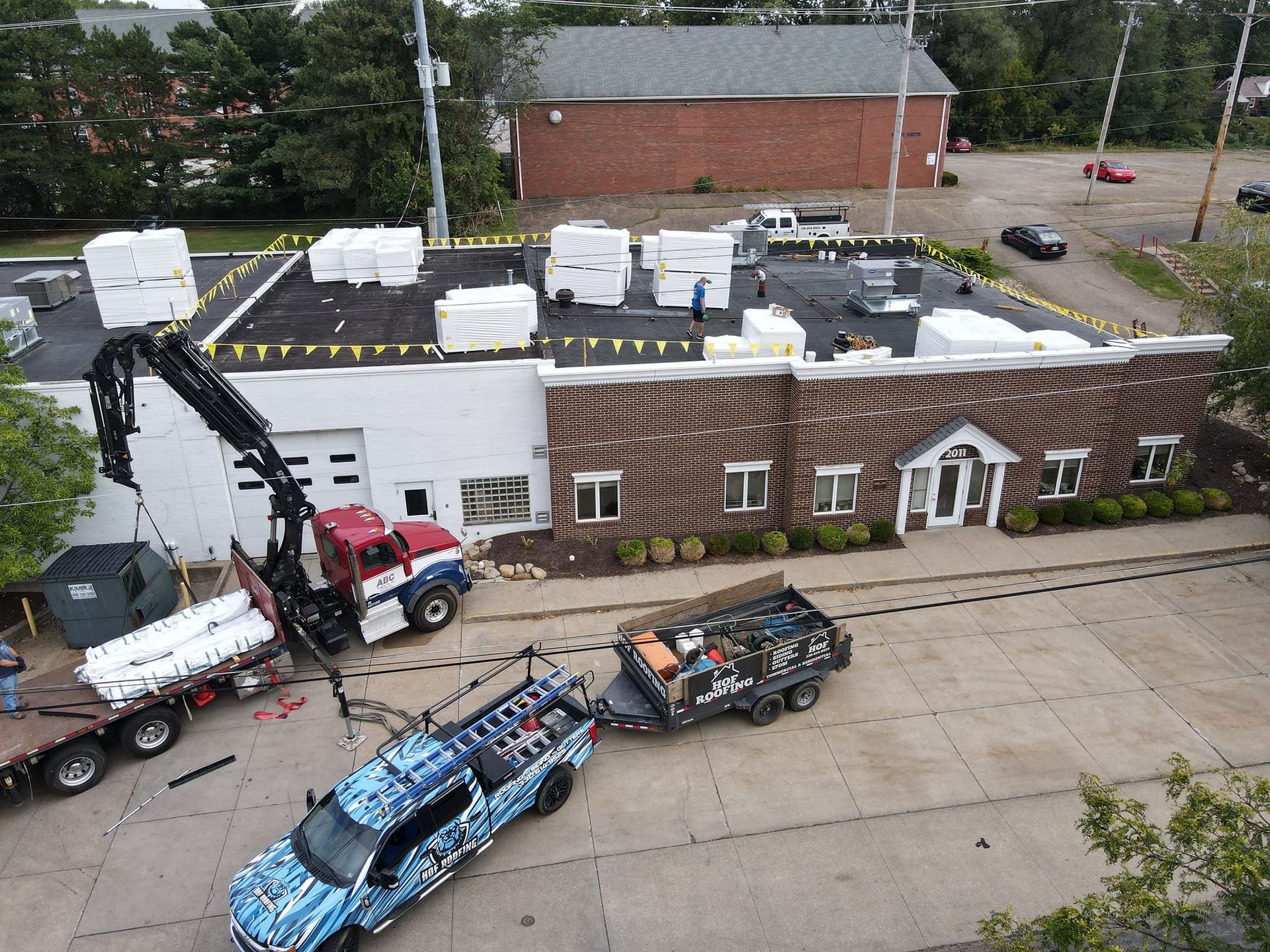 An aerial view of a truck being towed by another truck
