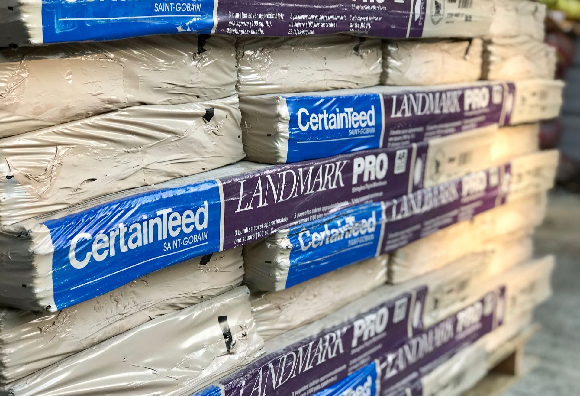 Several bags of certainteed landmark pro are stacked on top of each other