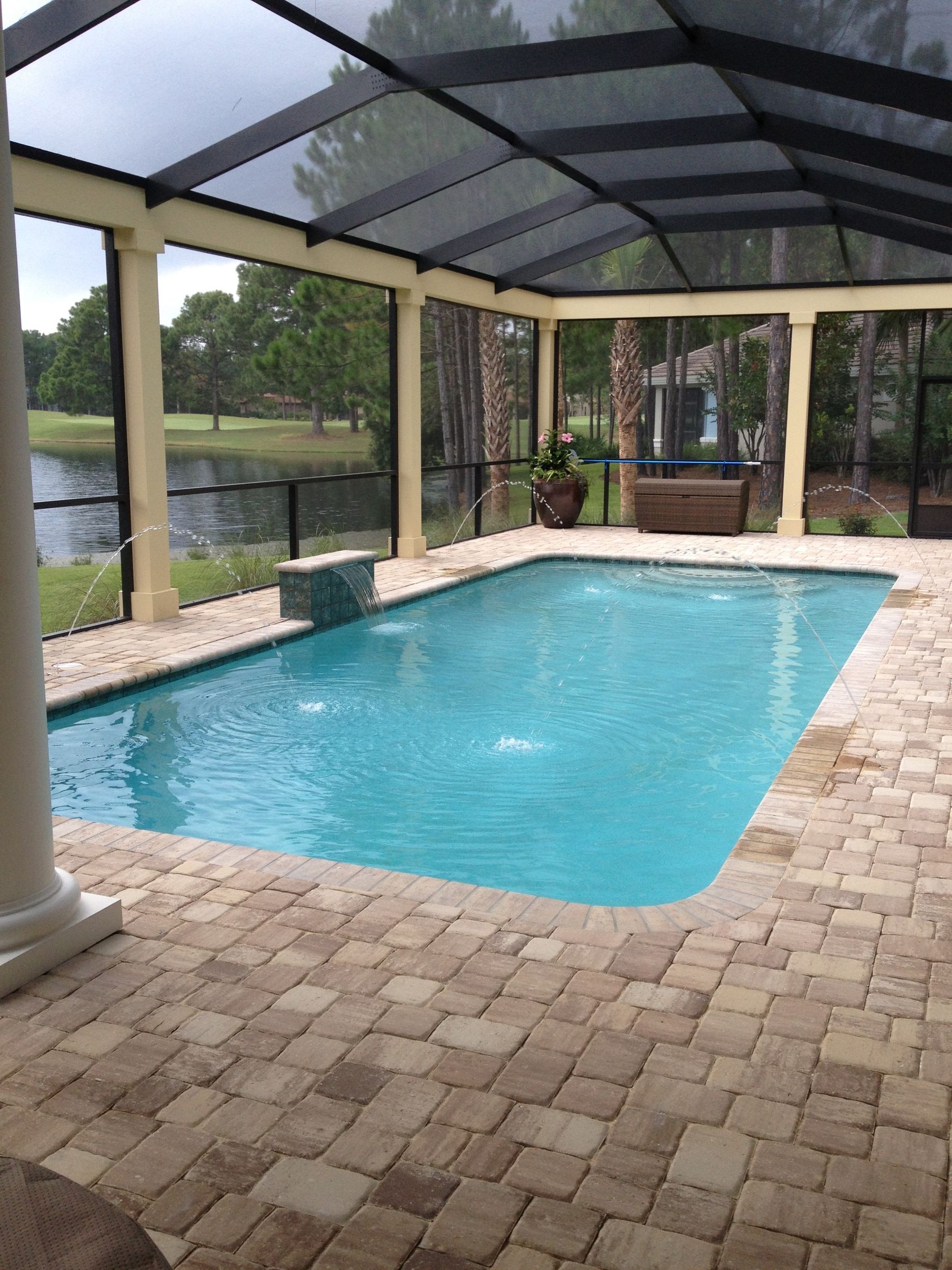 An aerial view of a house under construction with a truck parked in front of it.