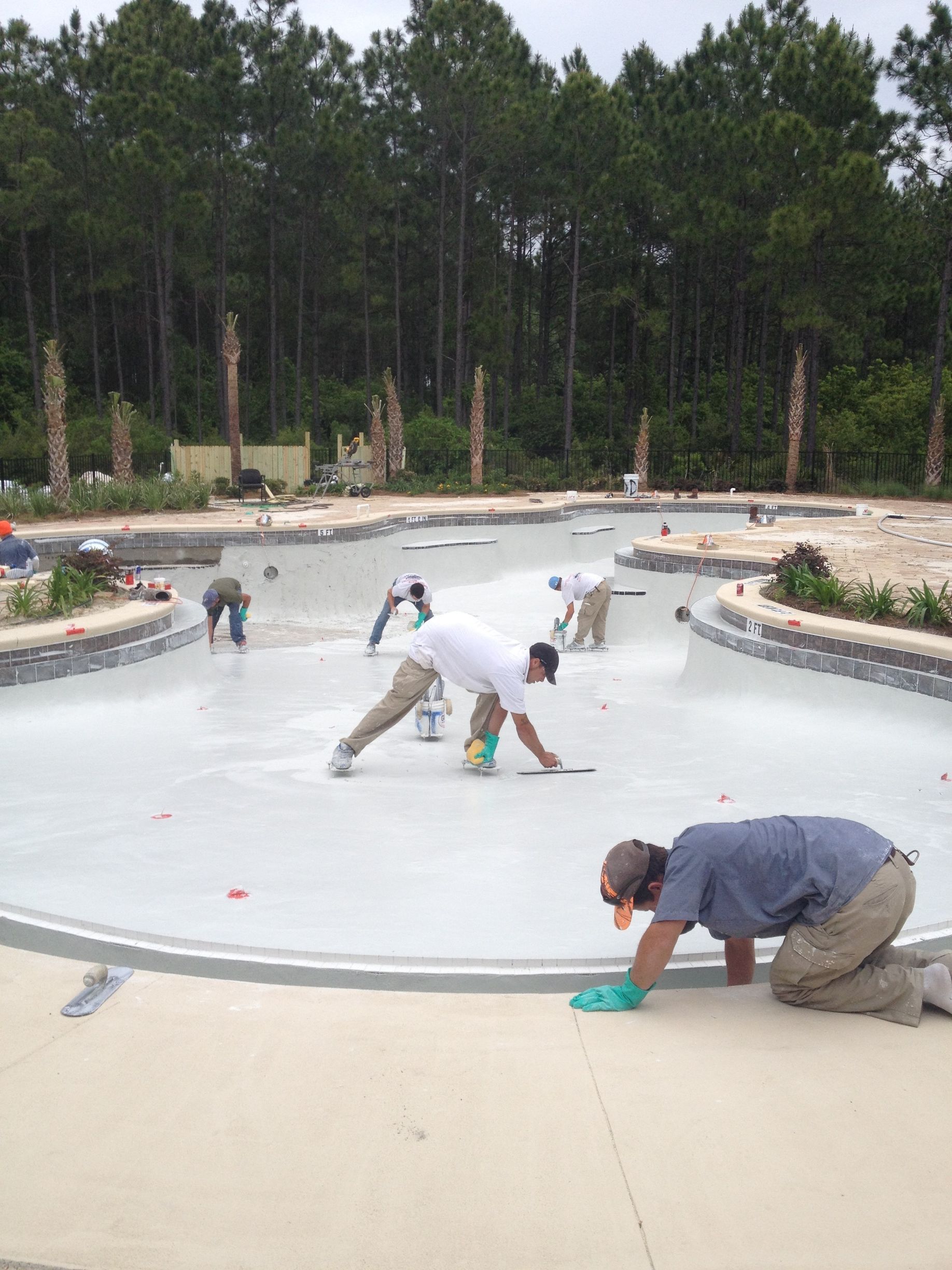 An aerial view of a house with a gray roof and a garage.
