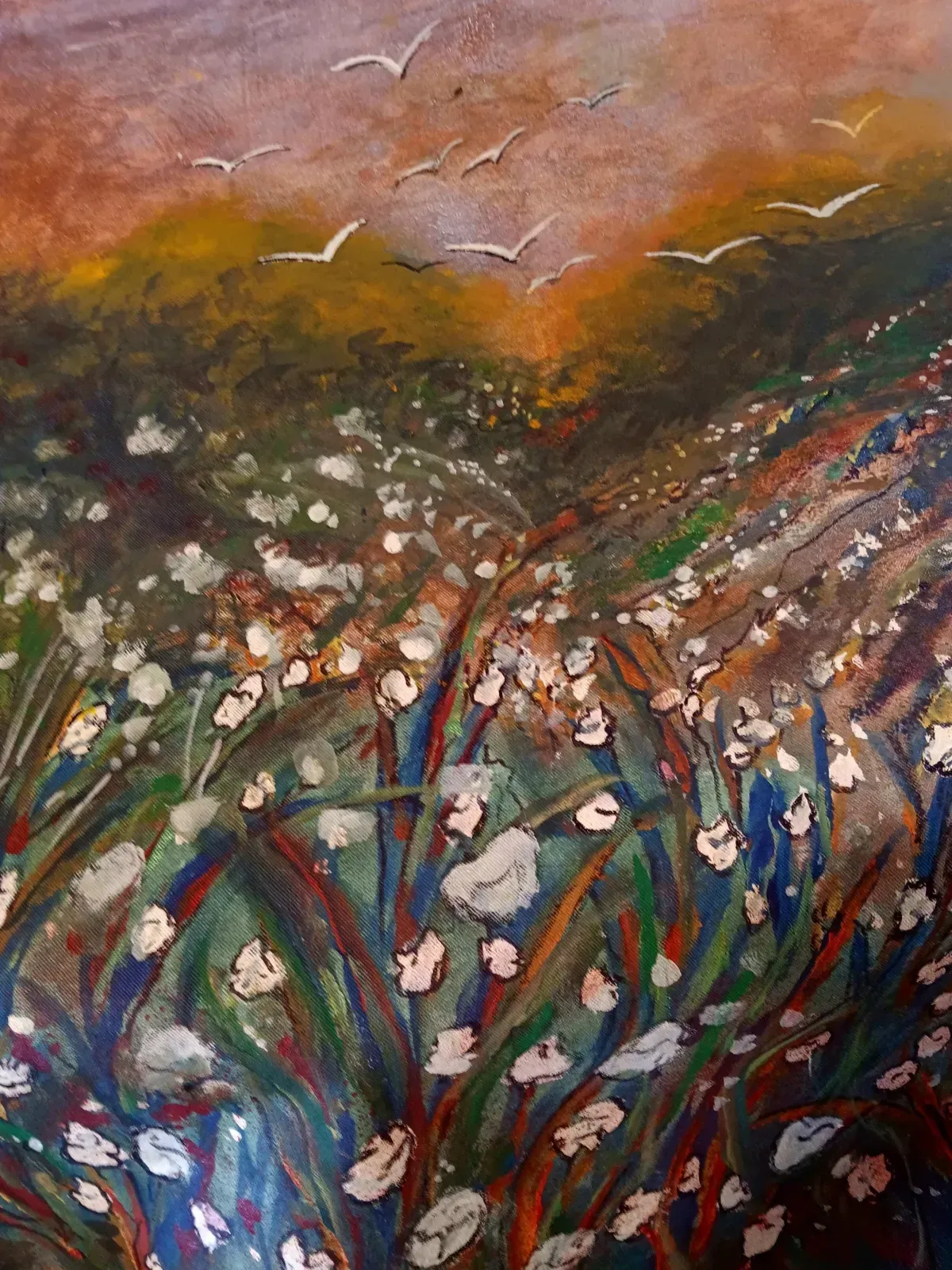 Field of white flowers with green and blue stems, under a sunset sky. Birds fly overhead.