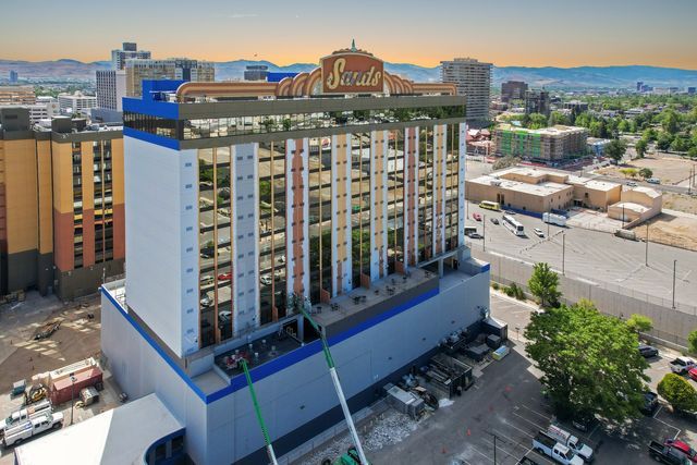An aerial view of a large building in the middle of a city.