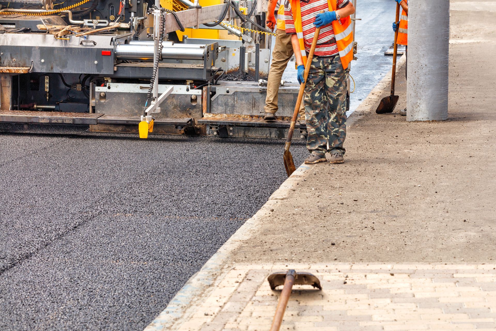 EmpireWorks Team Members Looking At Clipboard Managing a Construction Project