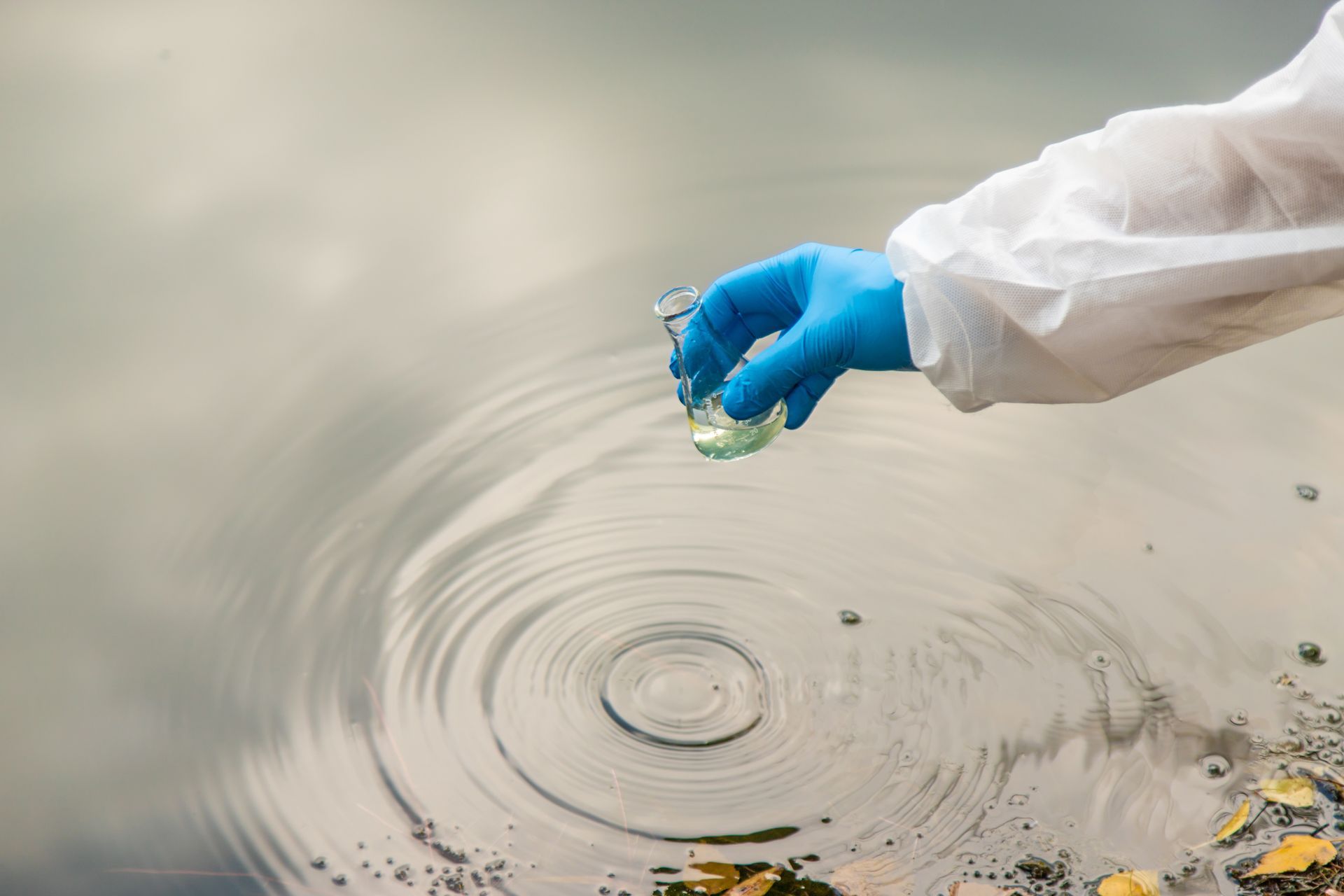 A parking garage with a lot of cars parked underneath it.