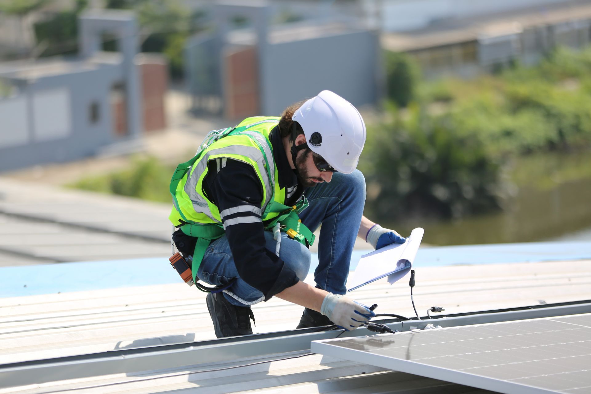 A group of construction workers are working on a roof
