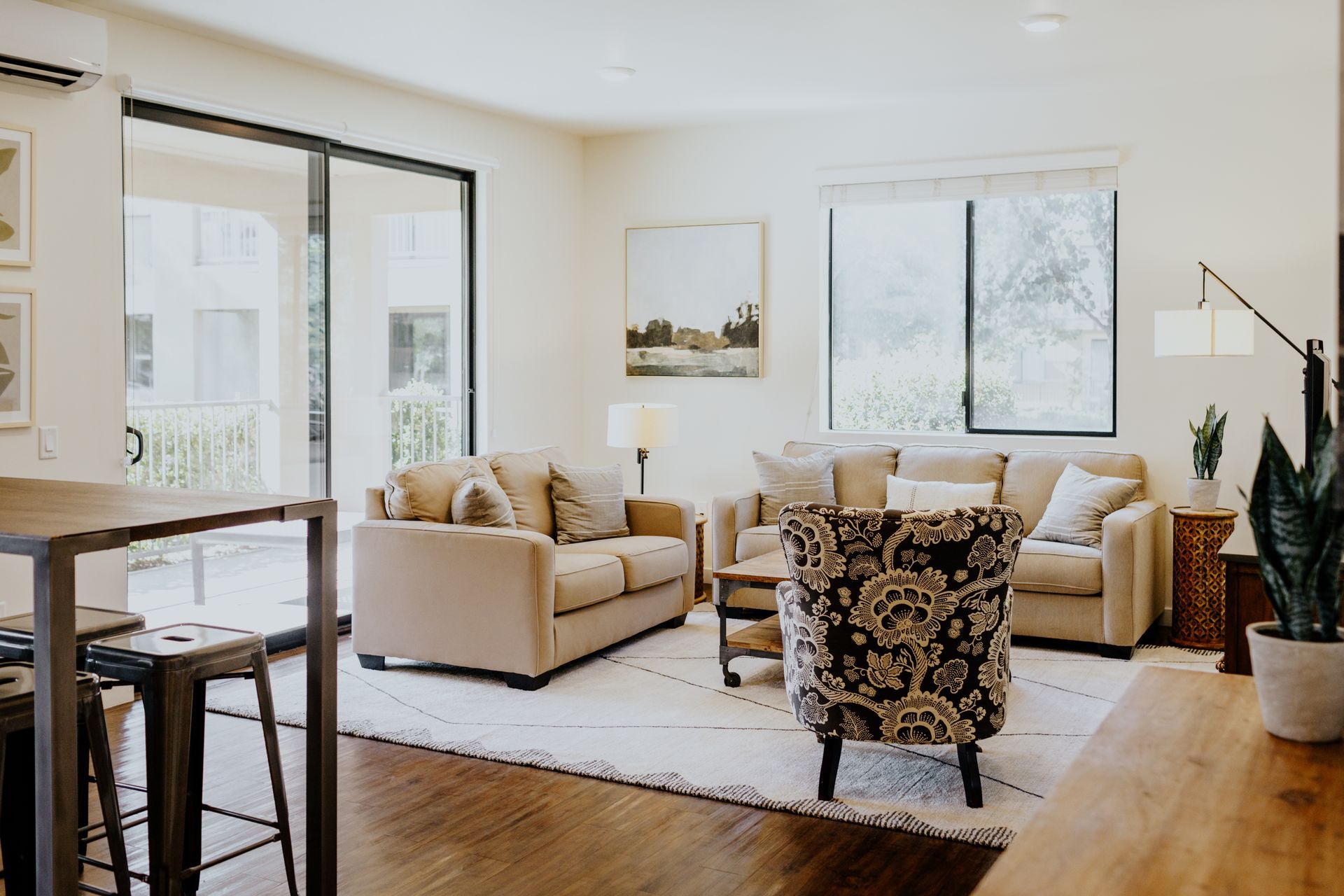 Bright, spacious living room area with ample seating