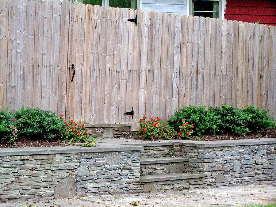 retaining wall along the fence