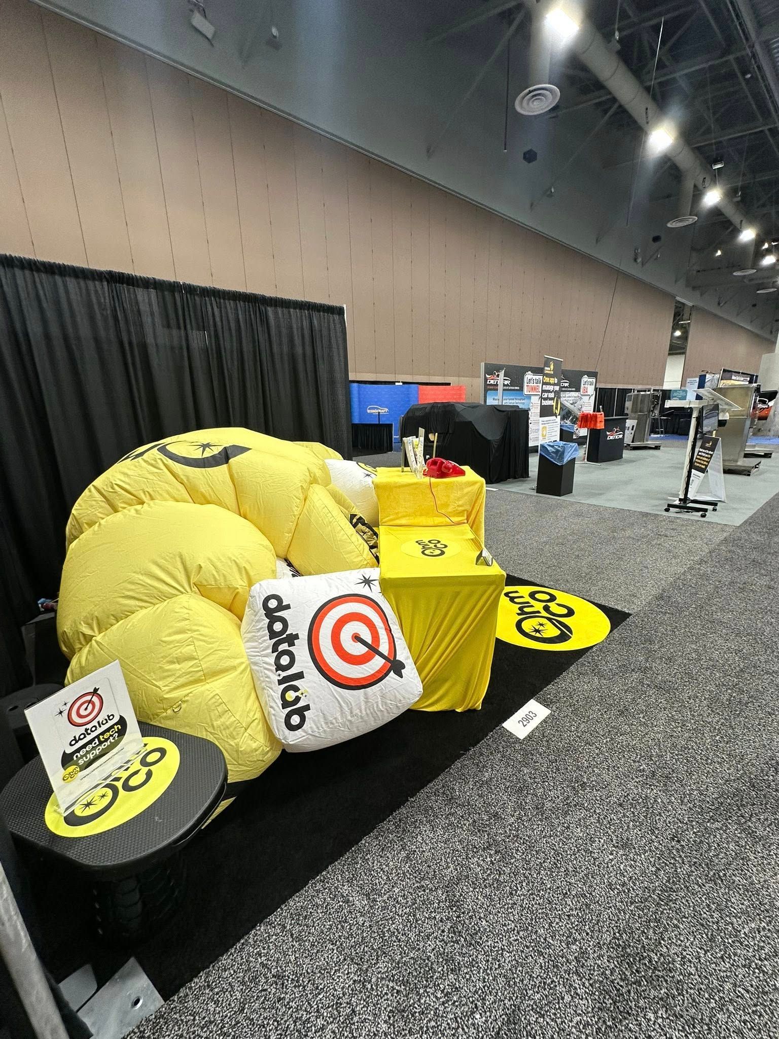 Mel and Mike Ohlinger OhmCo at the carwash show 2025 in vegas. Inflatable booth deflated
