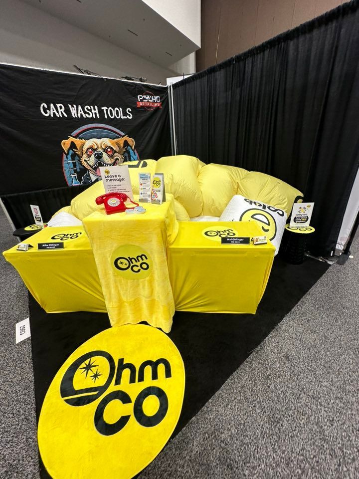 Mel and Mike Ohlinger OhmCo at the carwash show 2025 in vegas. Inflatable booth deflated