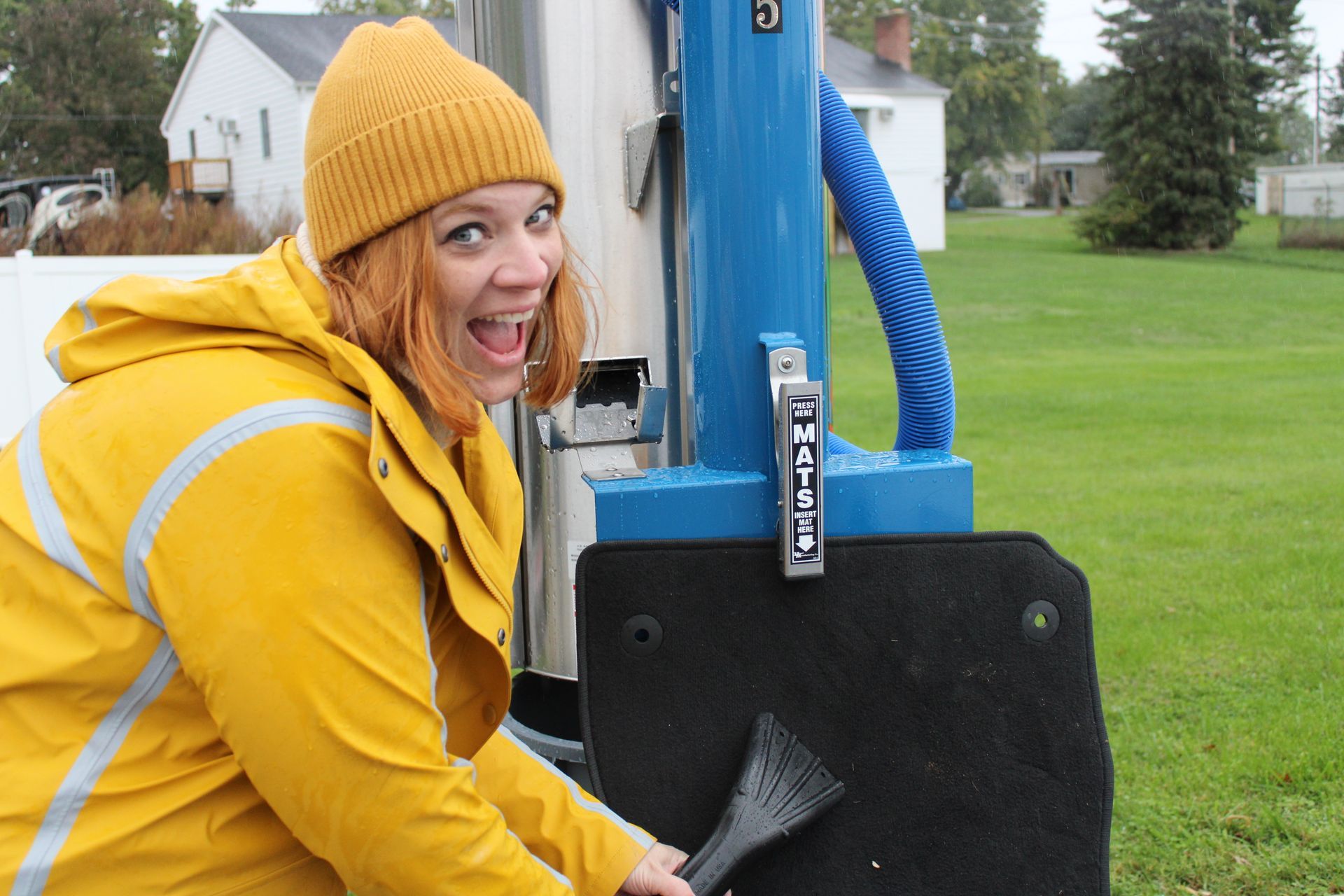 Mel Ohlinger vacuuming a carwash mat at anderson carwash in PA carwash photography