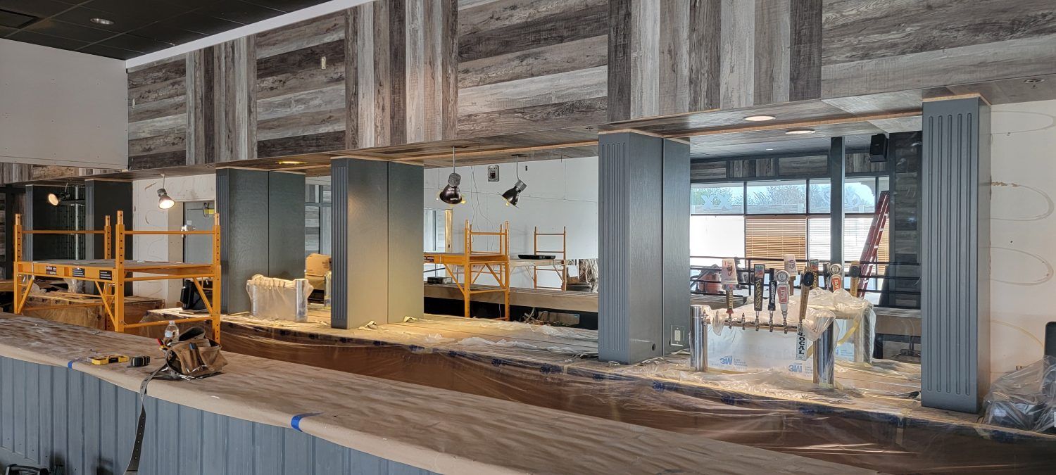 A large room with a lot of scaffolding in it is being built