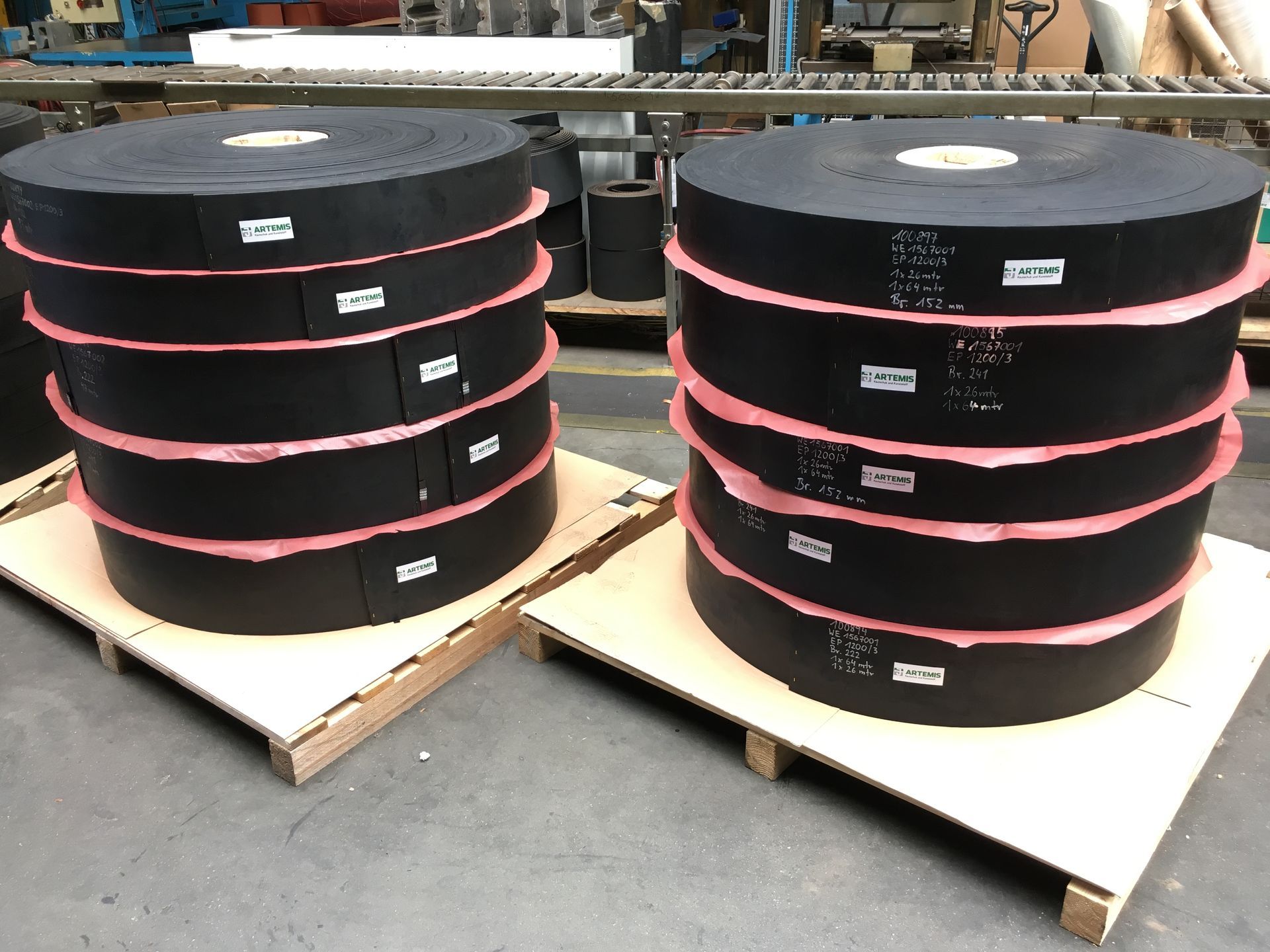 Close-up of a red snow grooming drag, showing the intricate design used for smoothing snow on ski trails.