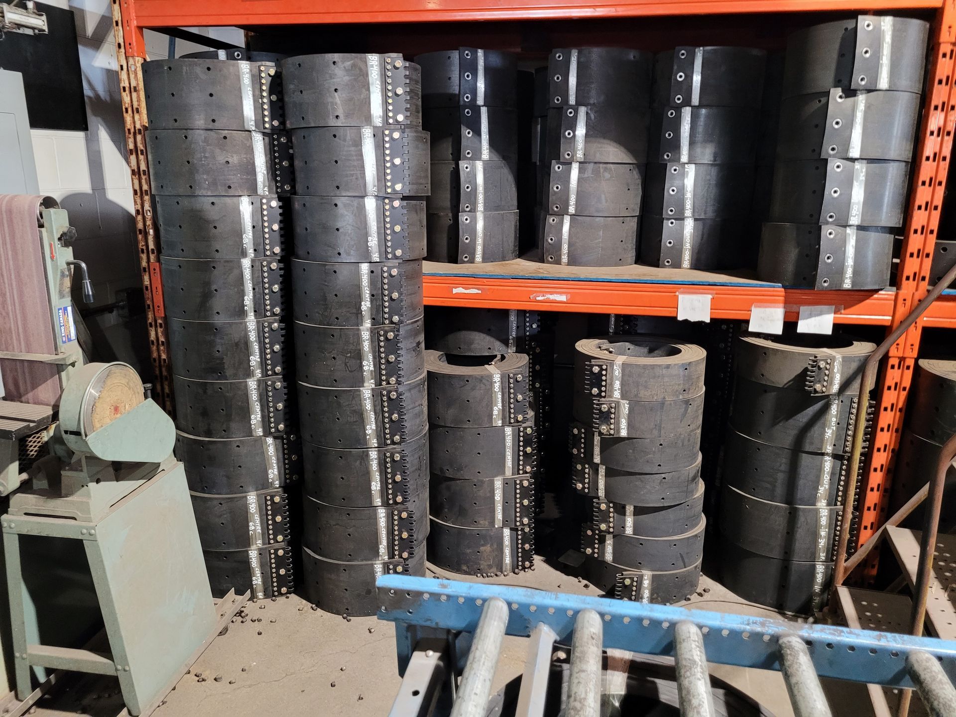 A warehouse filled with lots of tires and a ladder