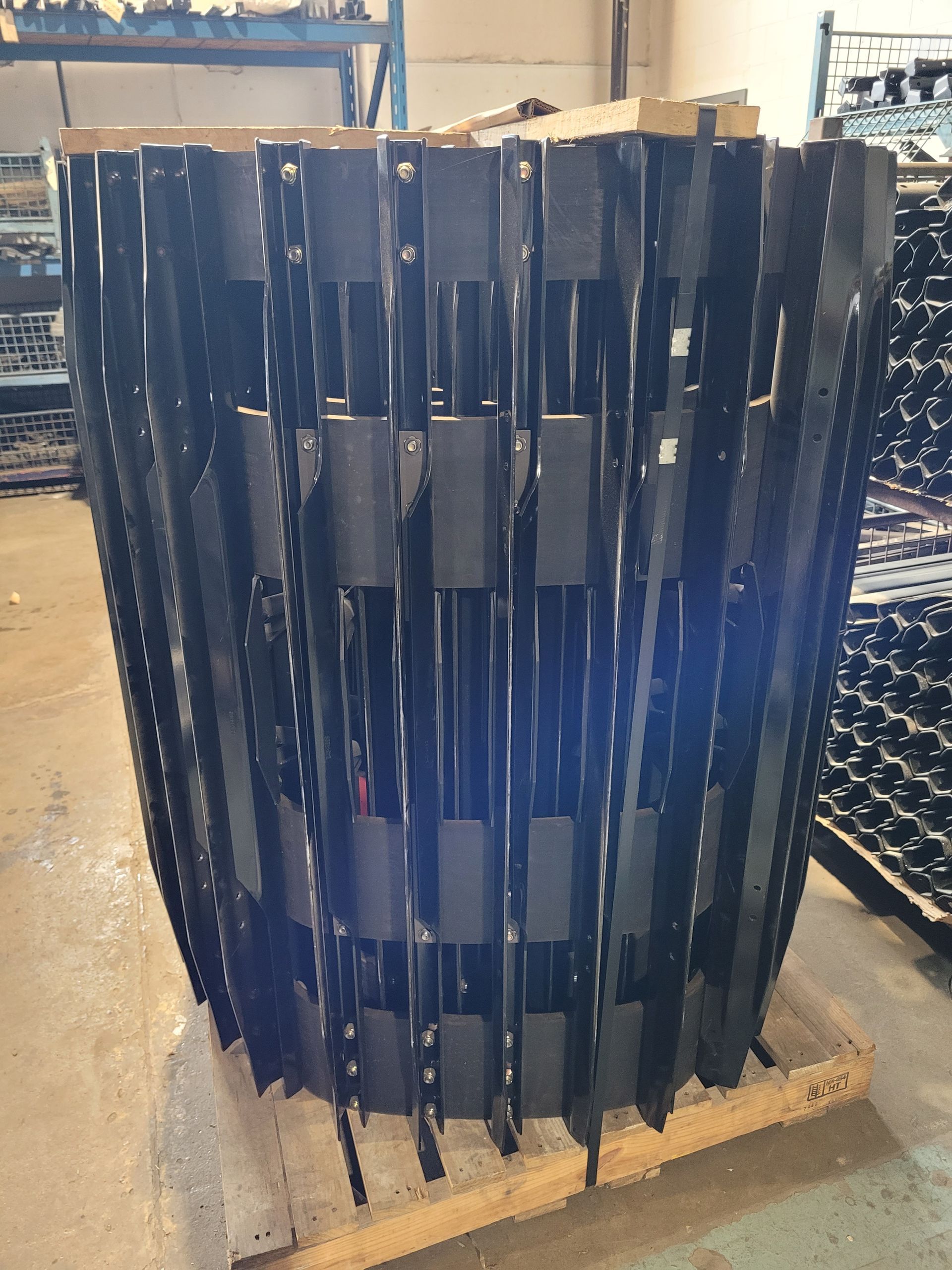 A large metal object is sitting on top of a wooden pallet.