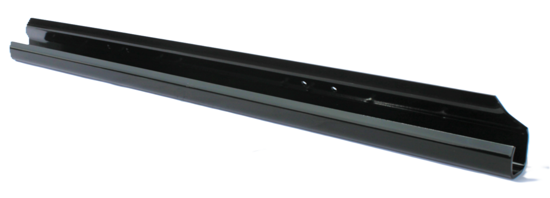 A black pen is sitting on a white surface.