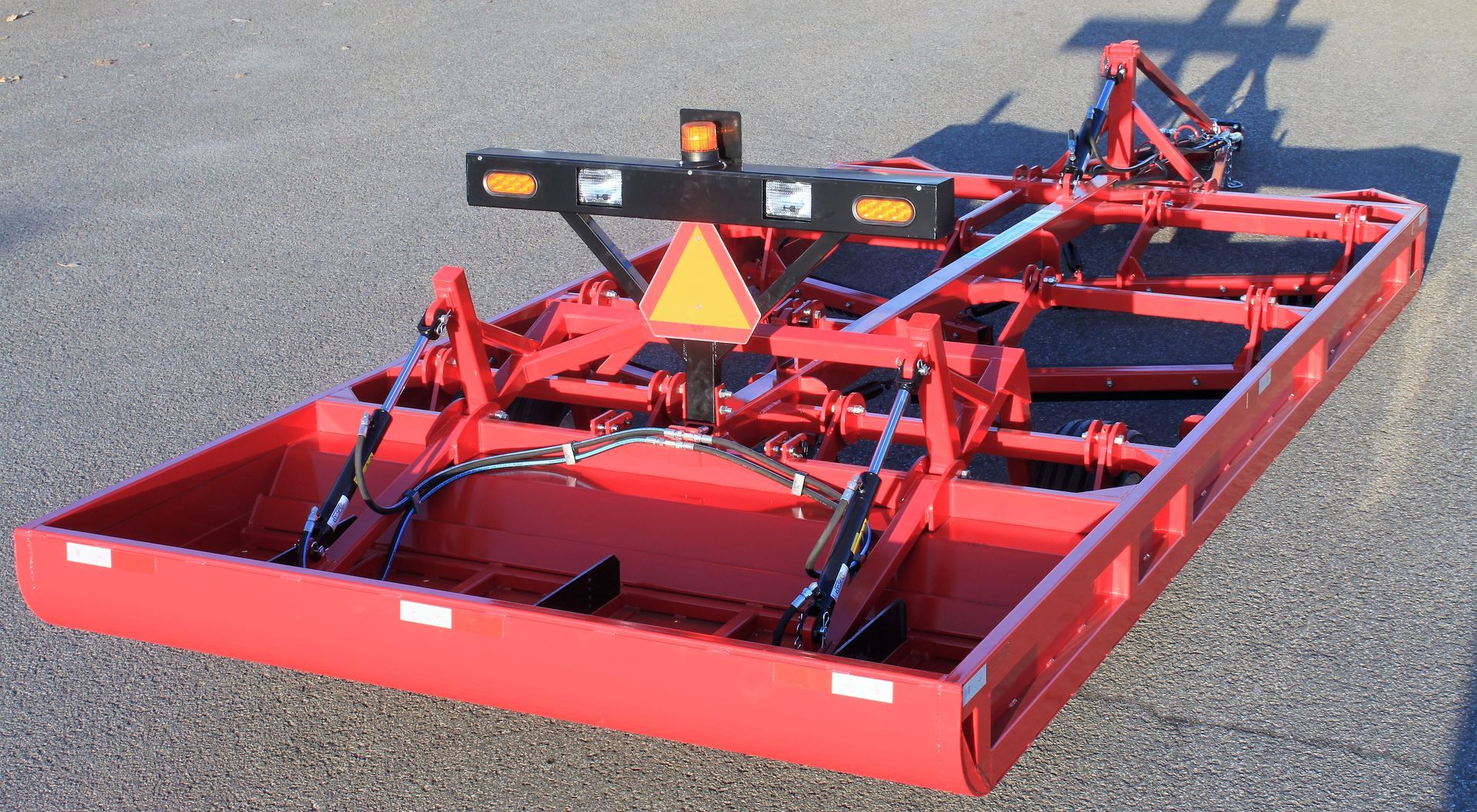 Snow groomer drag with rear signal lights for safe and efficient trail maintenance. 
