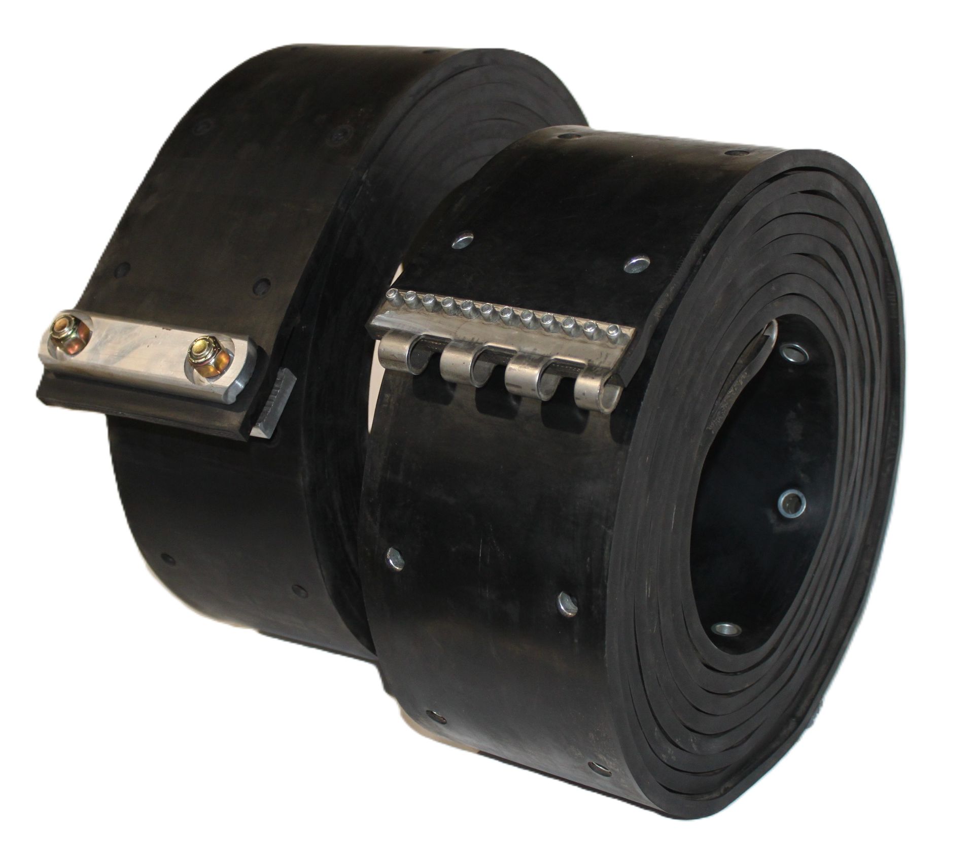 A black rubber coil with holes in it on a white surface