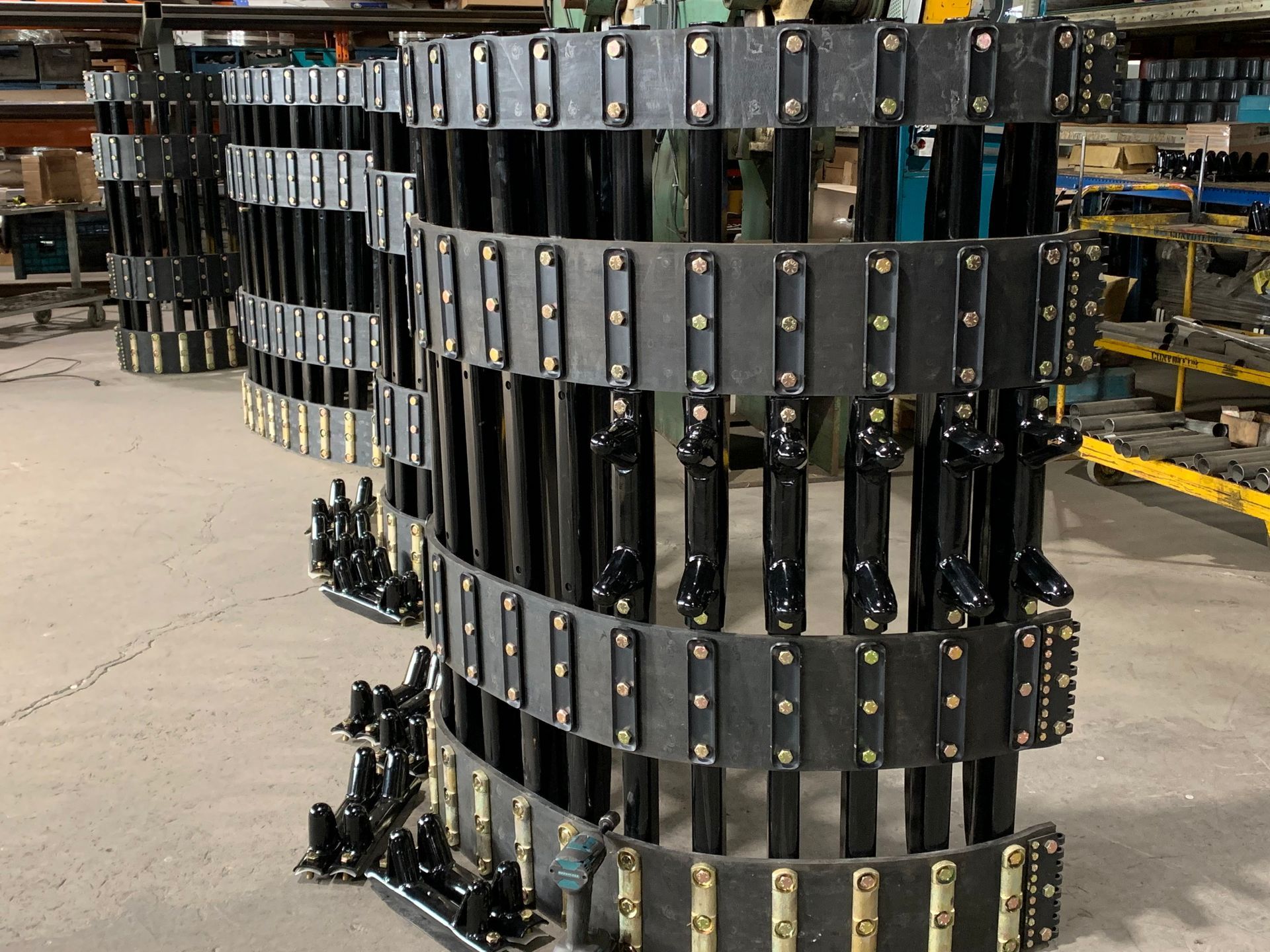 A bunch of chains are stacked on top of each other in a warehouse